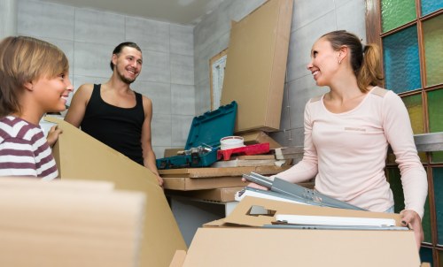 Man and van service vehicle and moving boxes in a residential setting