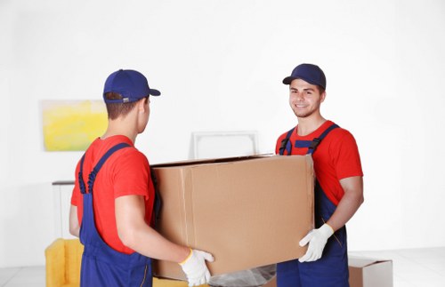 Packed moving boxes and furniture ready for transport