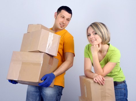 Professional movers handling office furniture during a Chessington business move