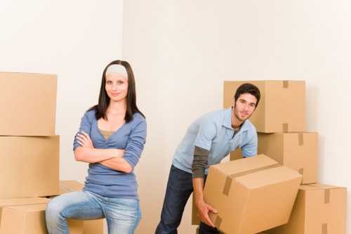 Professional moving truck team loading furniture in Chessington
