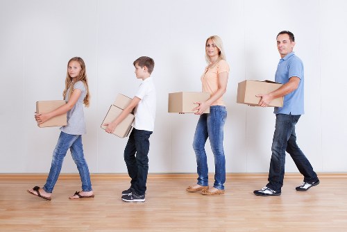 Worker checking heavy item handling during a move